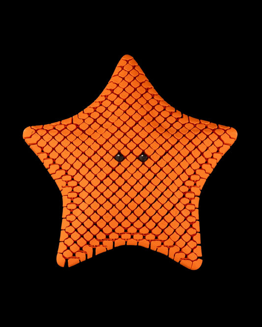 3D printed articulated sea star figure named Betsie, shown in multiple colors
