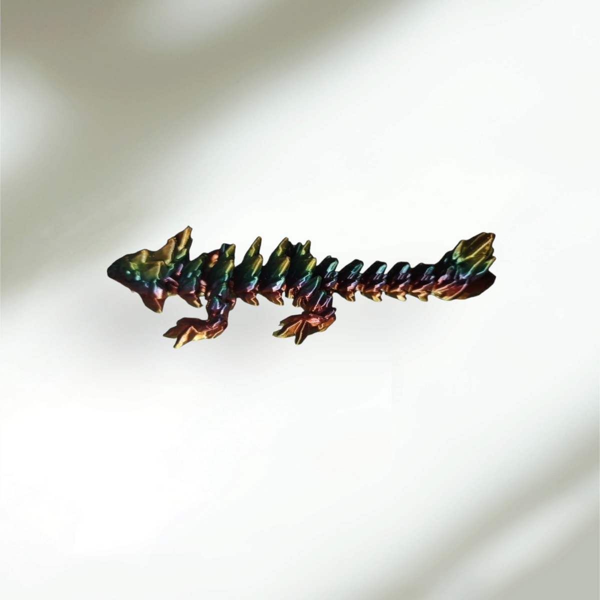 3D printed Crystal Dragon articulated figure with gem-toned angular scales