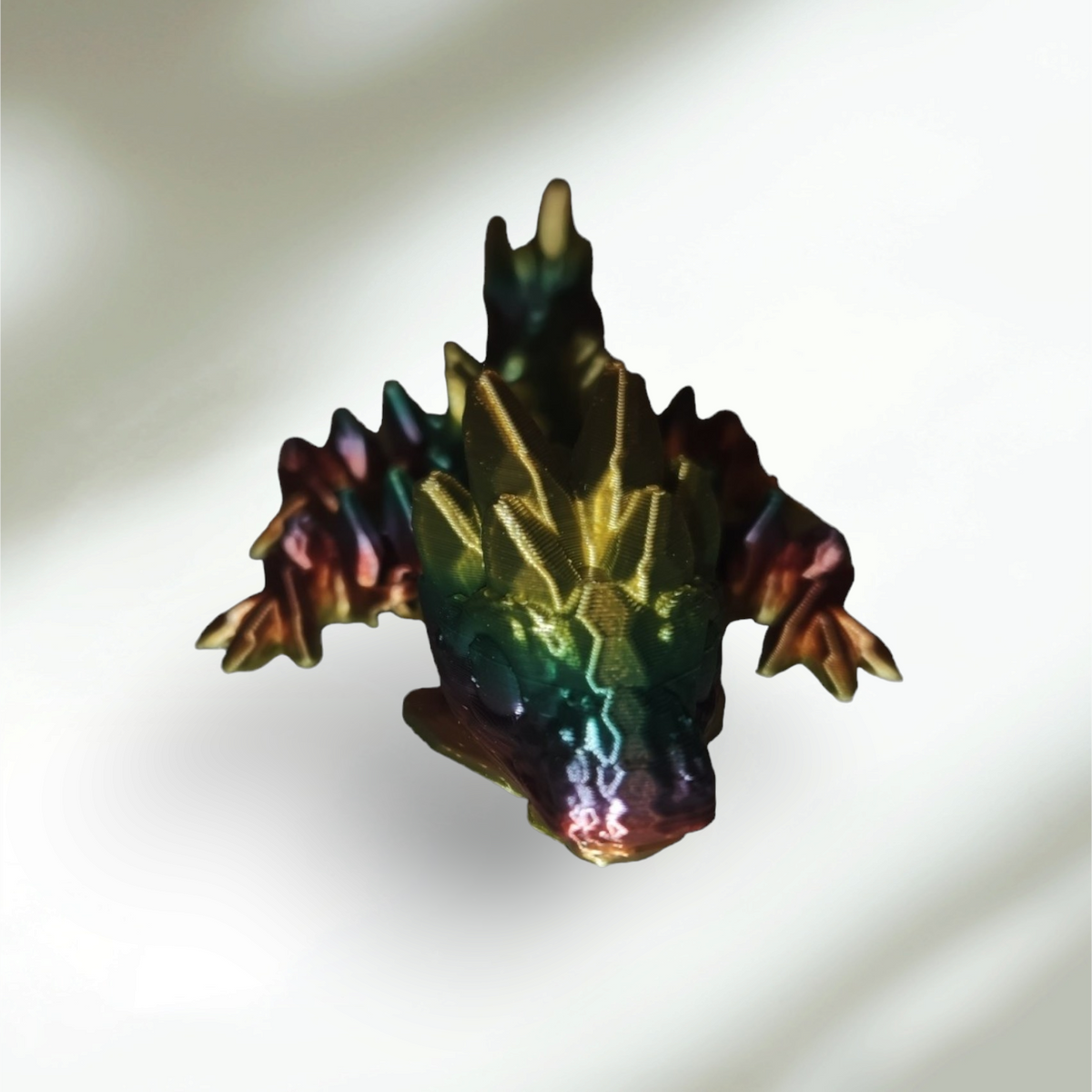 3D printed Crystal Dragon articulated figure with gem-toned angular scales